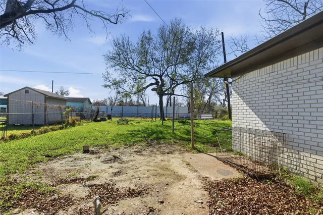 a backyard of a house with lots of green space