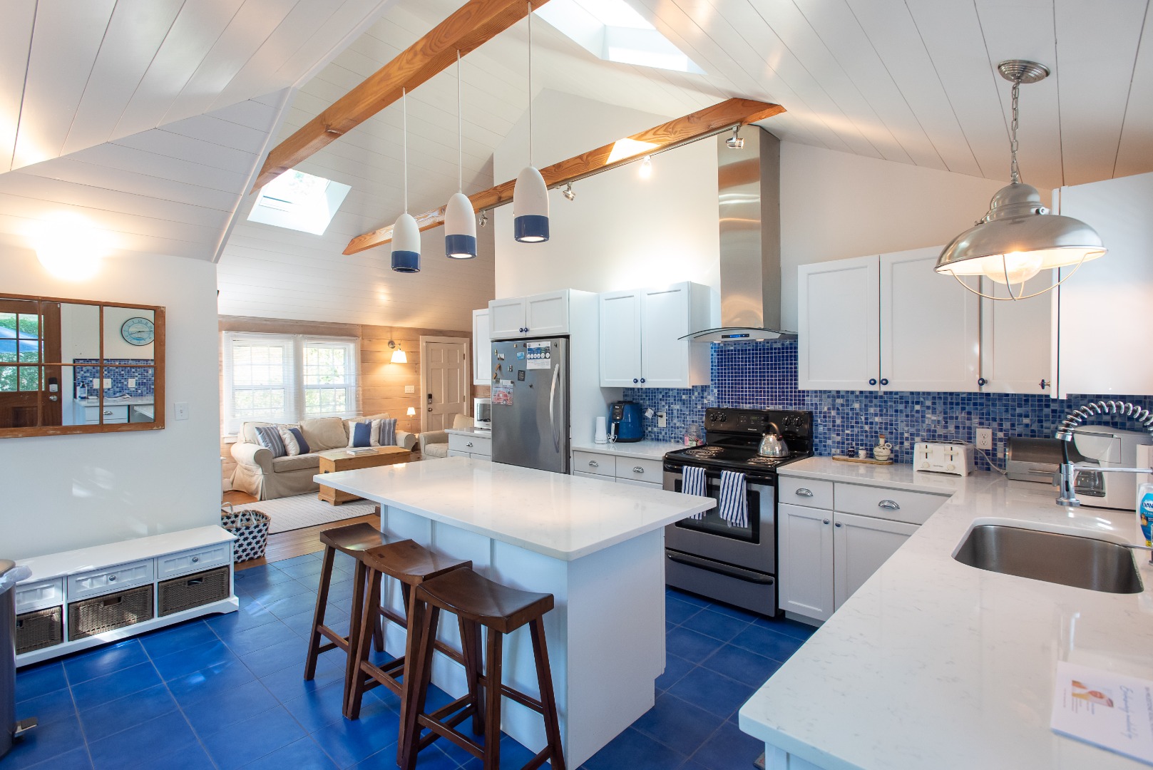 16 H Milestone Road, Unit 8 DIONIS Nantucket, MA 02554 - Photo 7 of 22 a large kitchen with a table and chairs