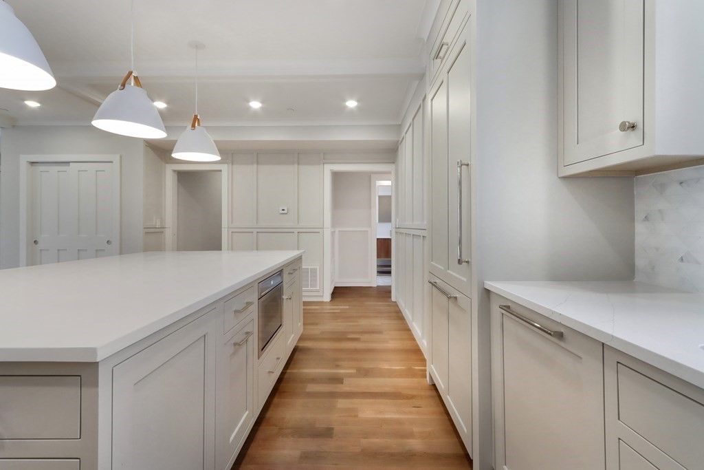 189 Babcock Street, Unit 2 Brookline, MA 02446 - Photo 15 of 39 a bathroom with a sink and a mirror