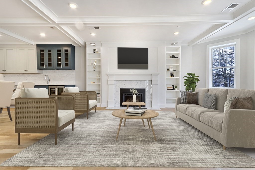 189 Babcock Street, Unit 2 Brookline, MA 02446 - Photo 2 of 39 a living room with furniture a flat screen tv and a fireplace