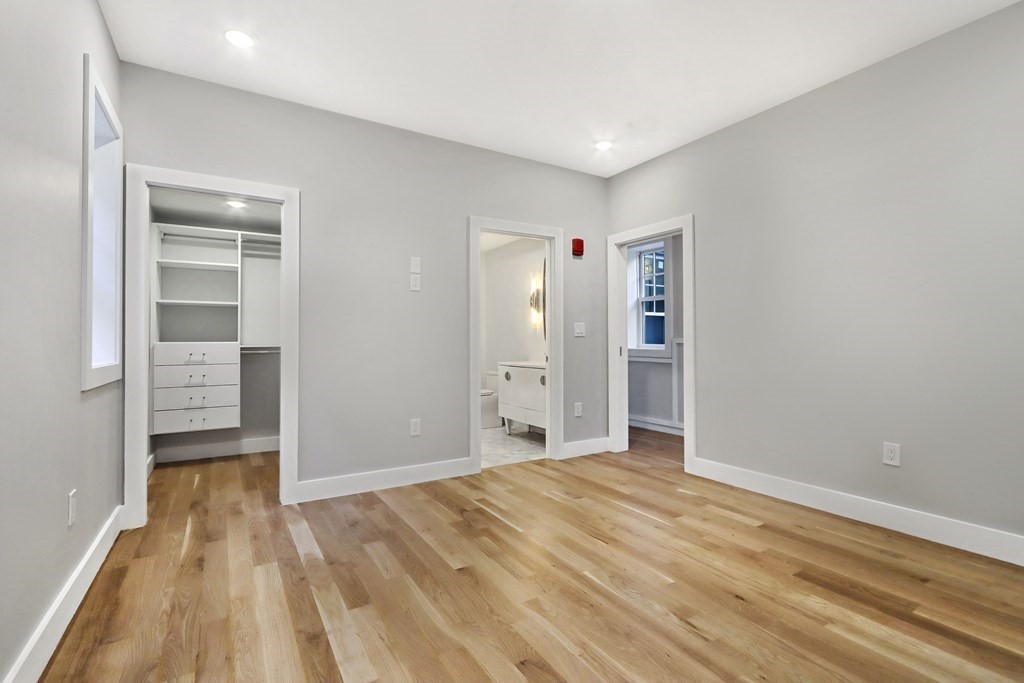 189 Babcock Street, Unit 2 Brookline, MA 02446 - Photo 28 of 39 wooden floor in an empty room with a window
