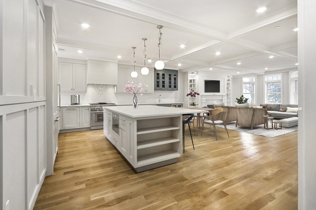 189 Babcock Street, Unit 2 Brookline, MA 02446 - Photo 3 of 39 a large kitchen with a large counter top appliances and cabinets