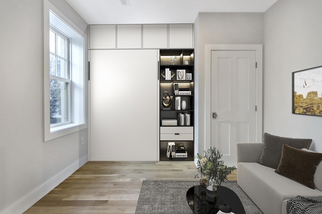 189 Babcock Street, Unit 2 Brookline, MA 02446 - Photo 31 of 39 a living room with furniture a rug and a window