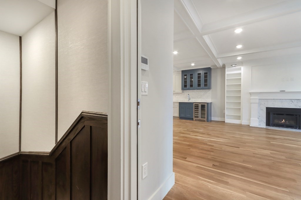 189 Babcock Street, Unit 2 Brookline, MA 02446 - Photo 4 of 39 a view of a hallway with an empty room