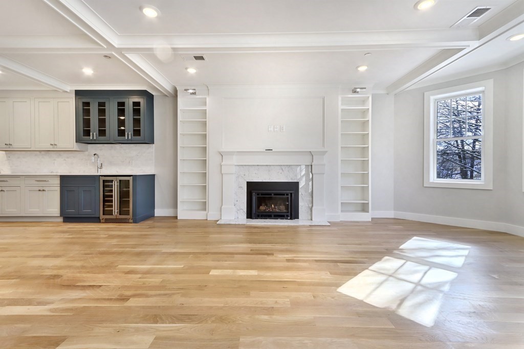 189 Babcock Street, Unit 2 Brookline, MA 02446 - Photo 5 of 39 a view of a living room with furniture and a fireplace