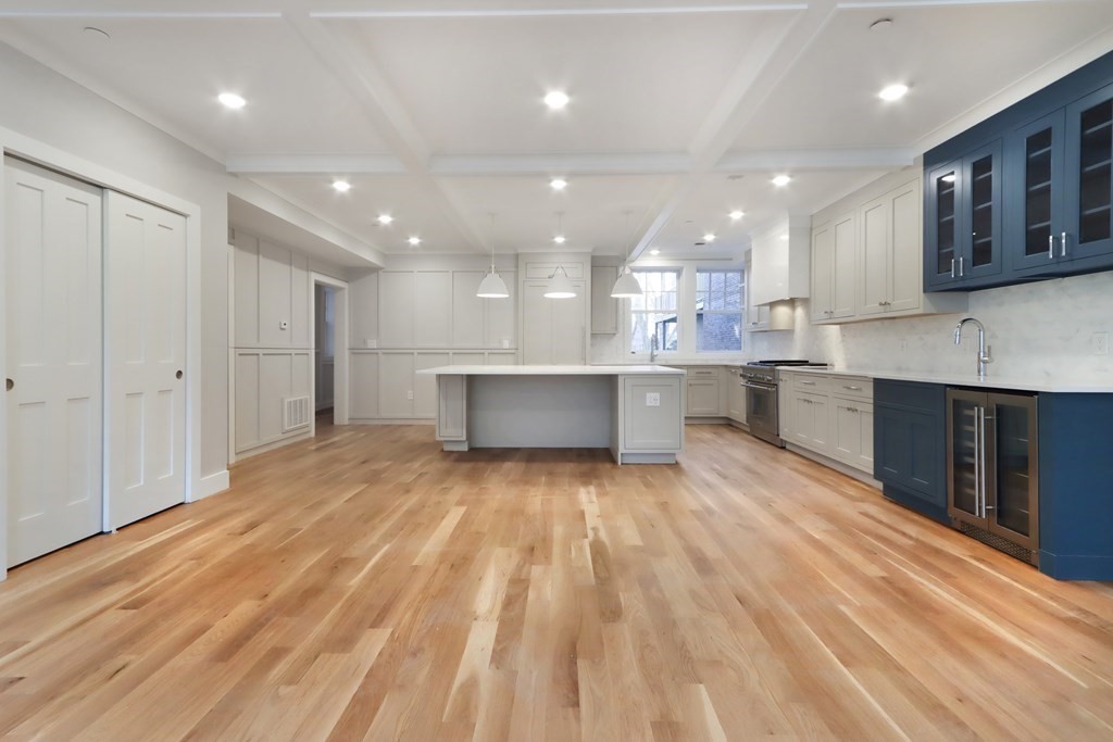 189 Babcock Street, Unit 2 Brookline, MA 02446 - Photo 8 of 39 a open kitchen with kitchen island a sink stainless steel appliances and cabinets