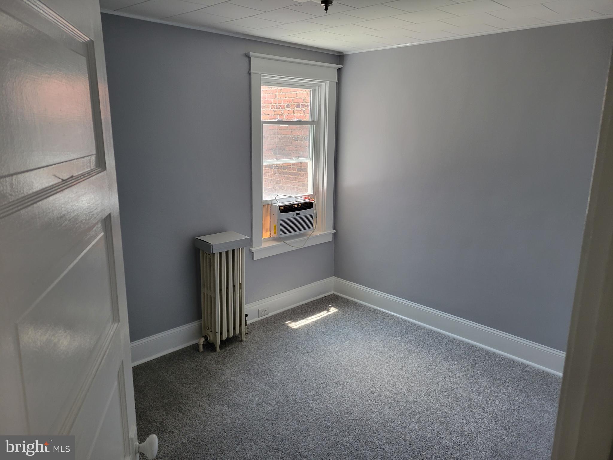 6757 Woodley Road Dundalk, MD 21222 - Photo 15 of 27 a view of an empty room with a window