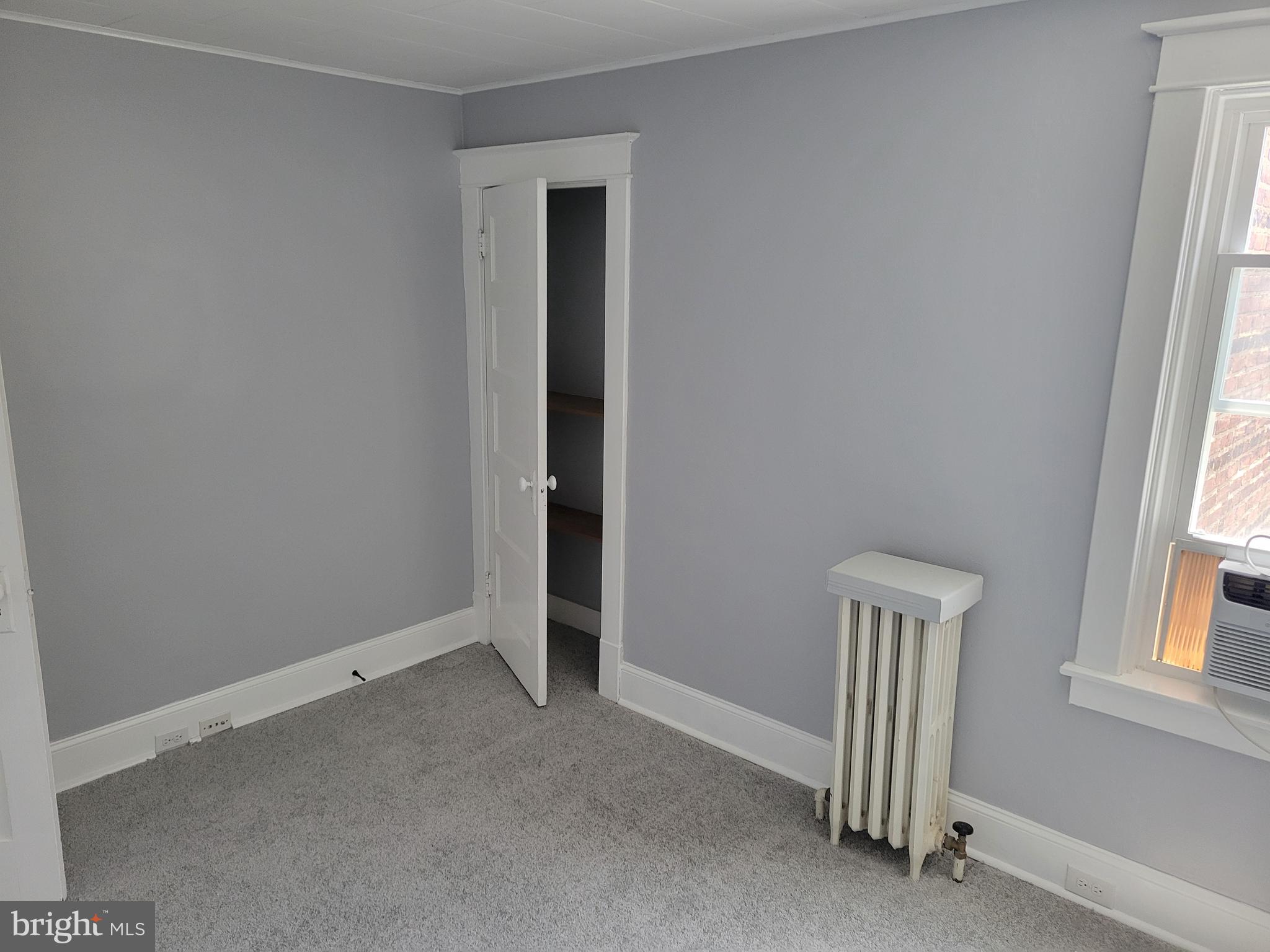 6757 Woodley Road Dundalk, MD 21222 - Photo 16 of 27 an empty room with windows