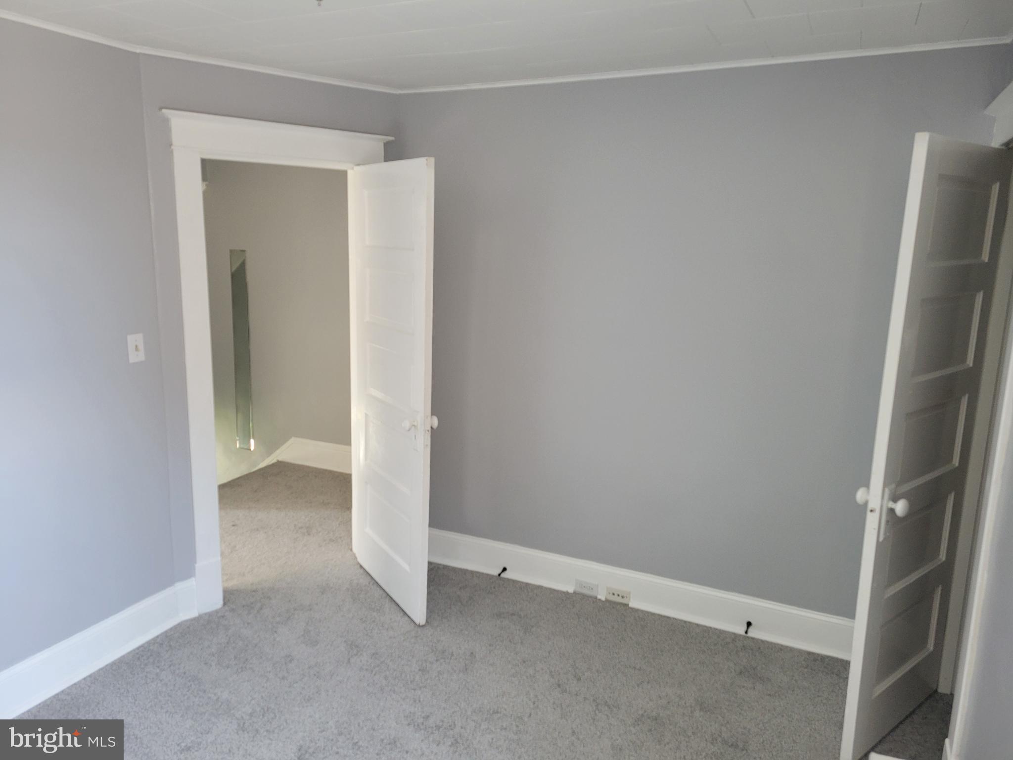 6757 Woodley Road Dundalk, MD 21222 - Photo 17 of 27 an empty room with closet