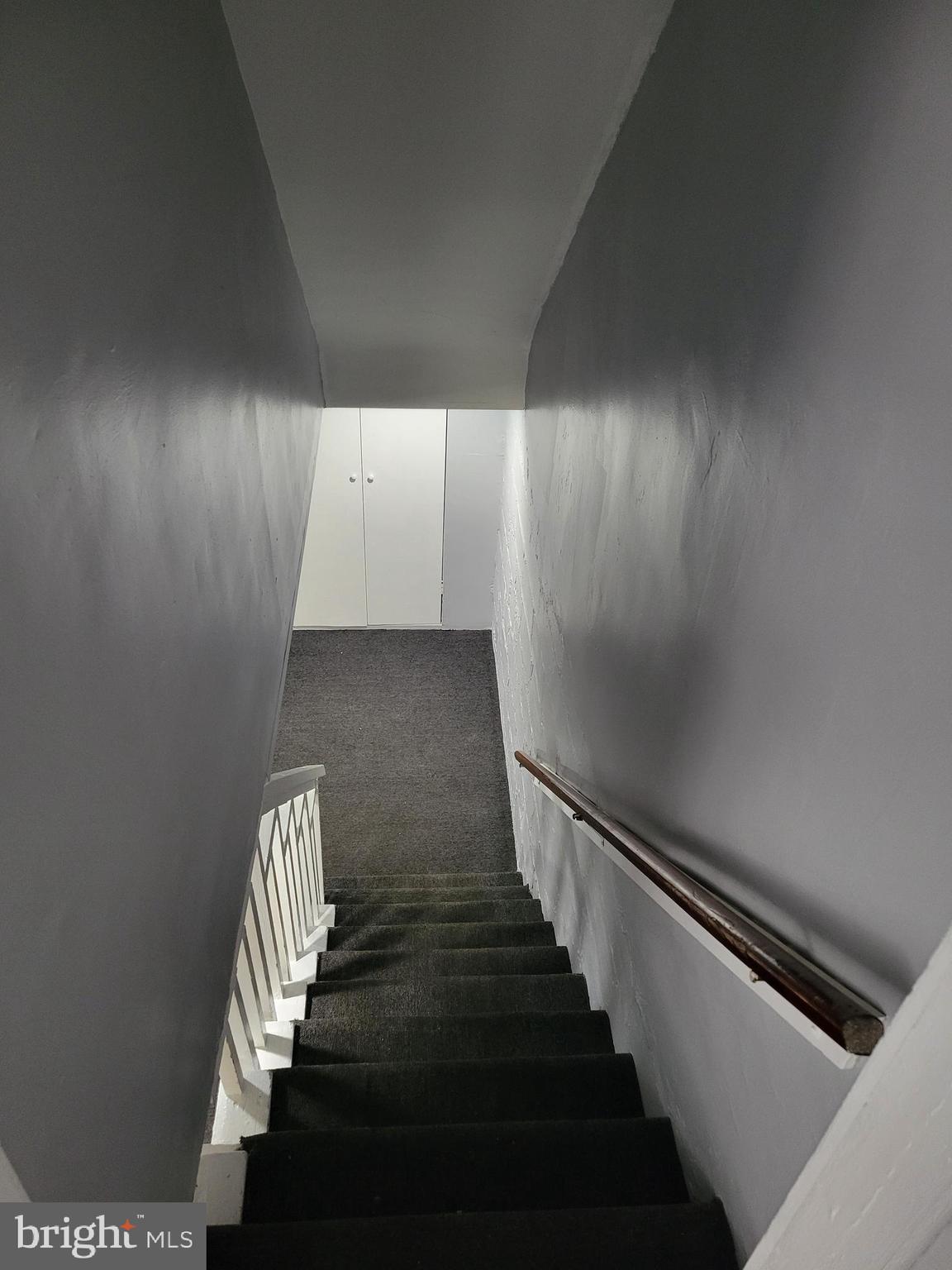 6757 Woodley Road Dundalk, MD 21222 - Photo 23 of 27 a view of entryway and hall with wooden floor