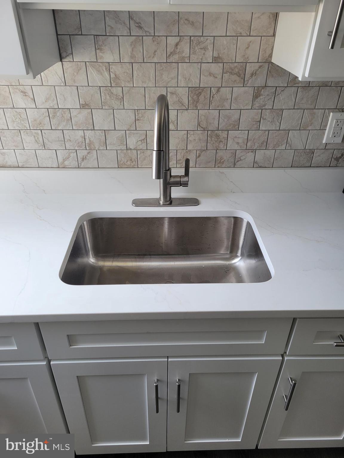 6757 Woodley Road Dundalk, MD 21222 - Photo 5 of 27 a close view of sink and tap