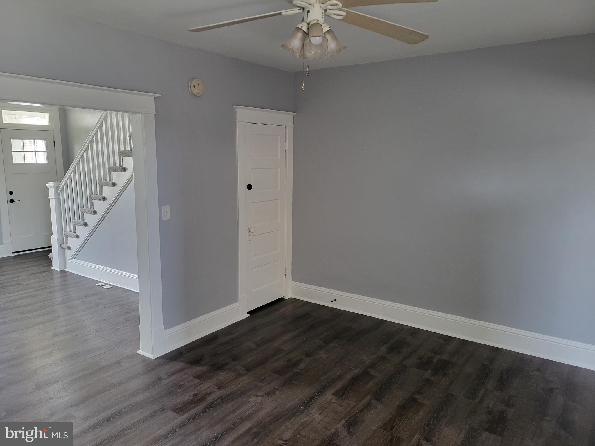 6757 Woodley Road Dundalk, MD 21222 - Photo 10 of 27 wooden floor in an empty room with a window