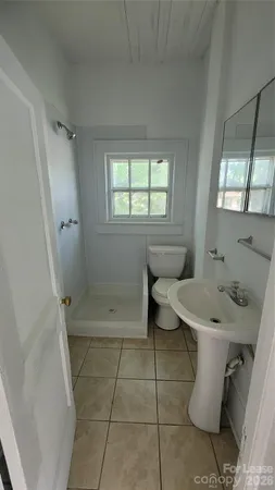 a bathroom with a sink toilet and tub
