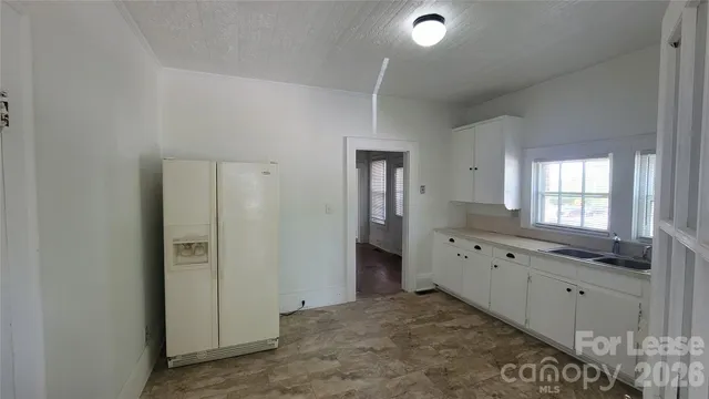 a view of a bathroom with sink and mirror