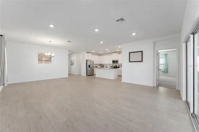 a view of a livingroom with furniture and a stove