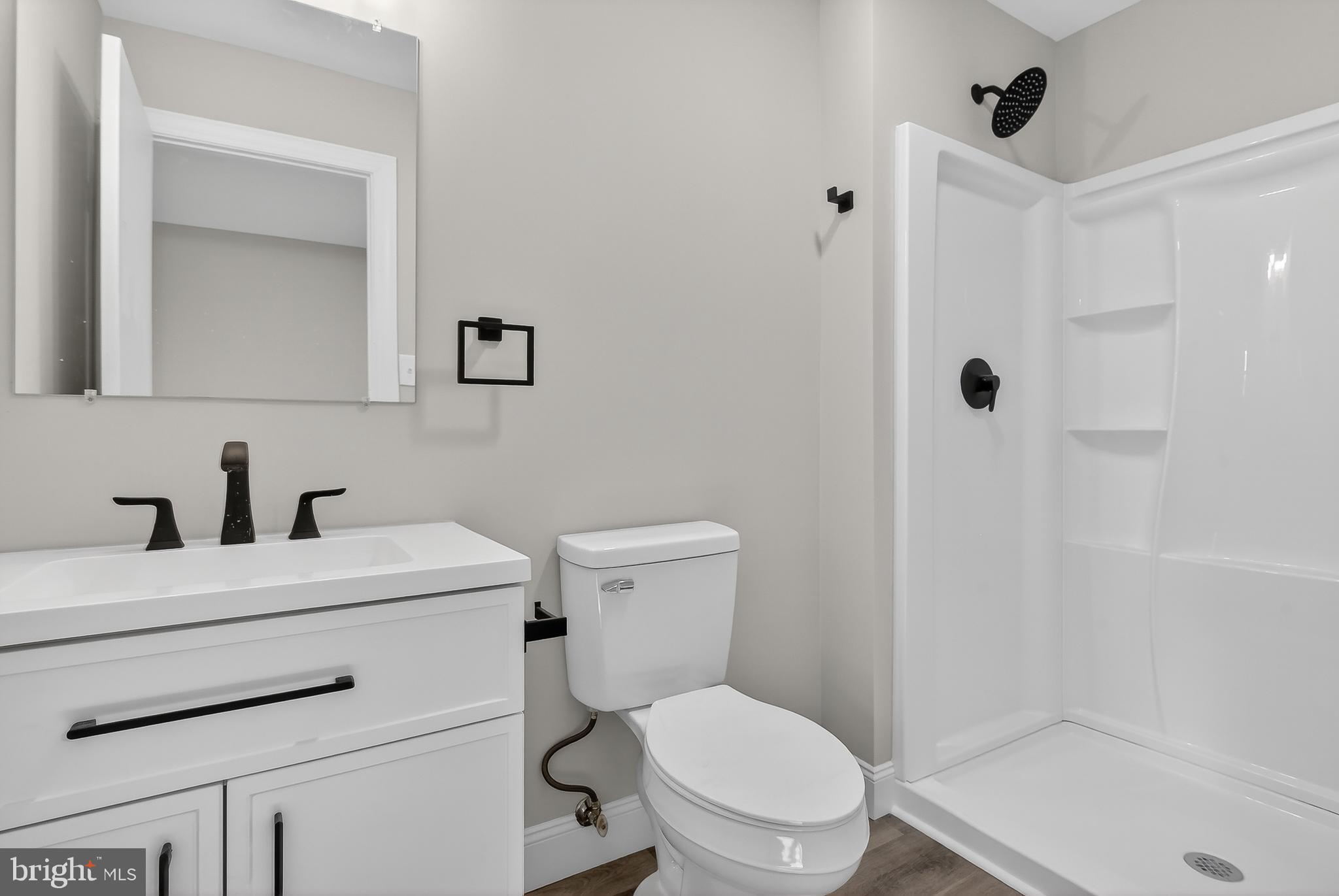 5960 Clover Road Harrisburg, PA 17112 - Photo 15 of 39 a bathroom with a sink a toilet and shower