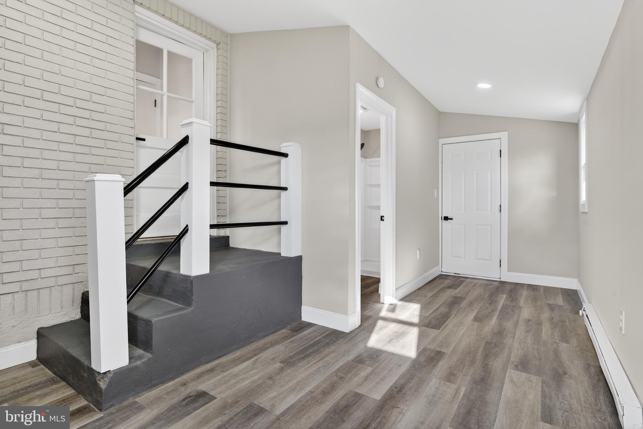 5960 Clover Road Harrisburg, PA 17112 - Photo 23 of 39 a view of an empty room with wooden floor and entryway
