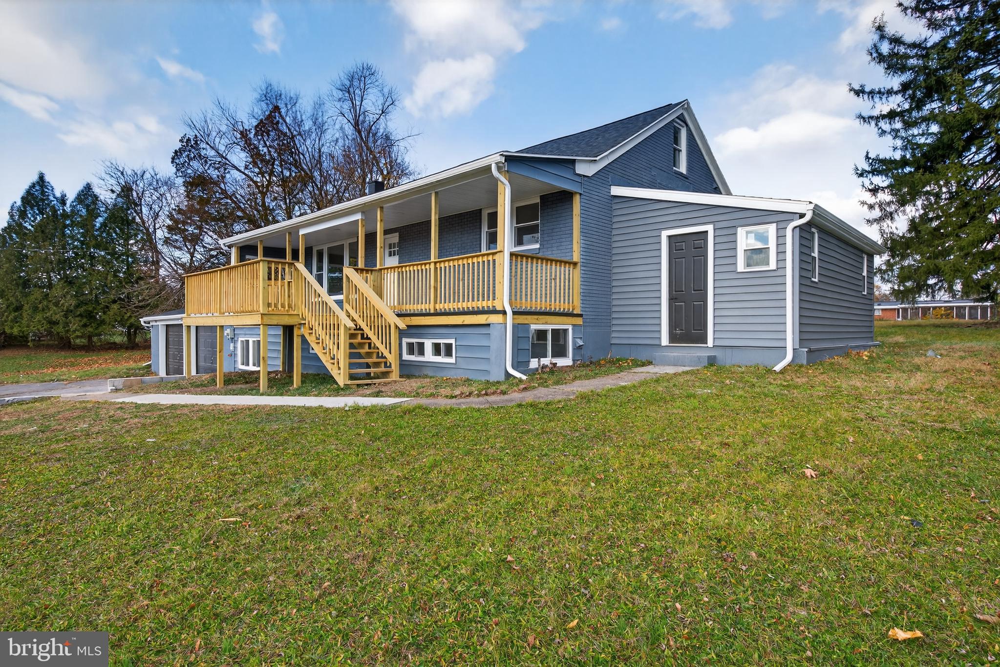 5960 Clover Road Harrisburg, PA 17112 - Photo 35 of 39 a view of a house with a backyard and a patio