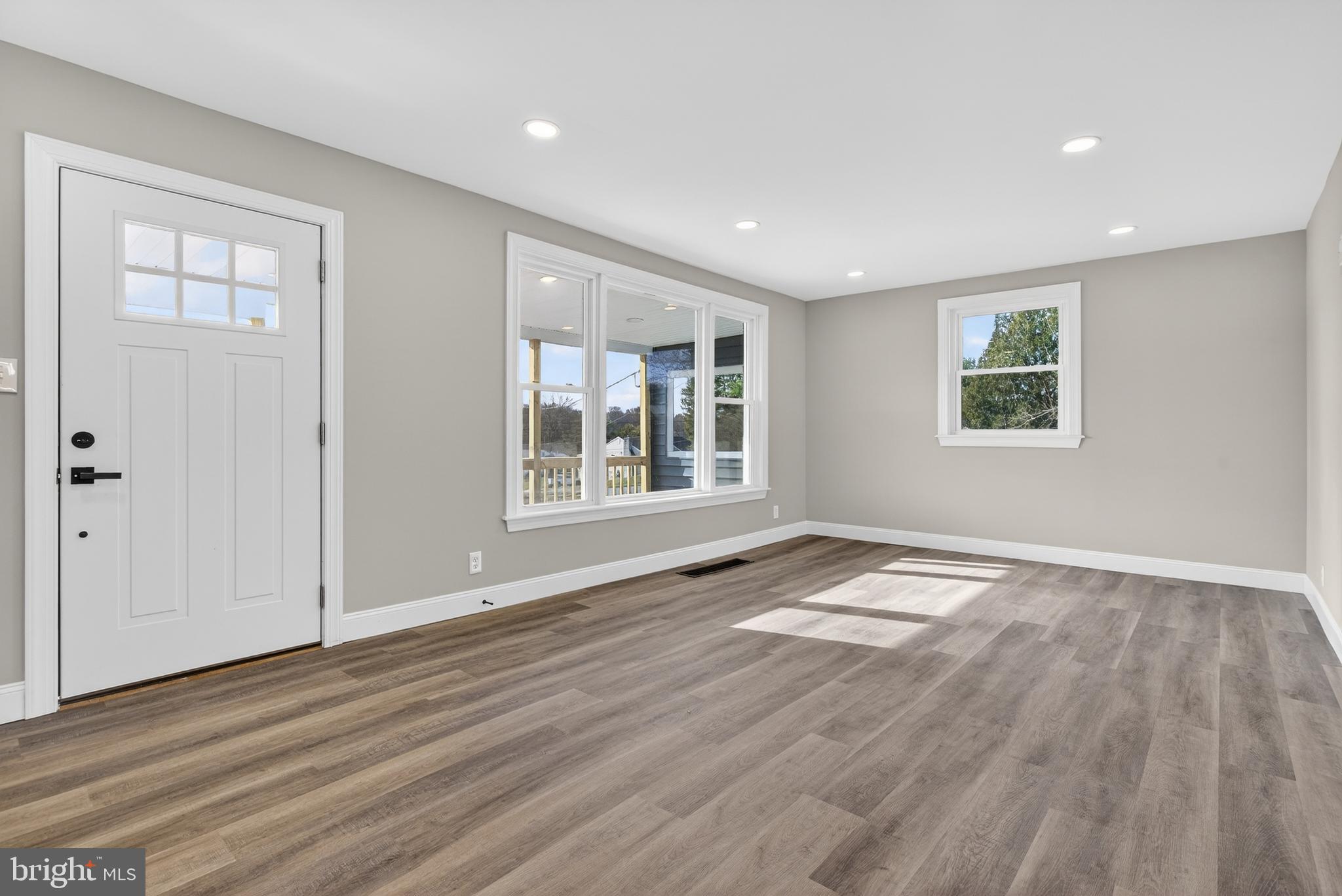 5960 Clover Road Harrisburg, PA 17112 - Photo 10 of 39 a view of an empty room with wooden floor and a window