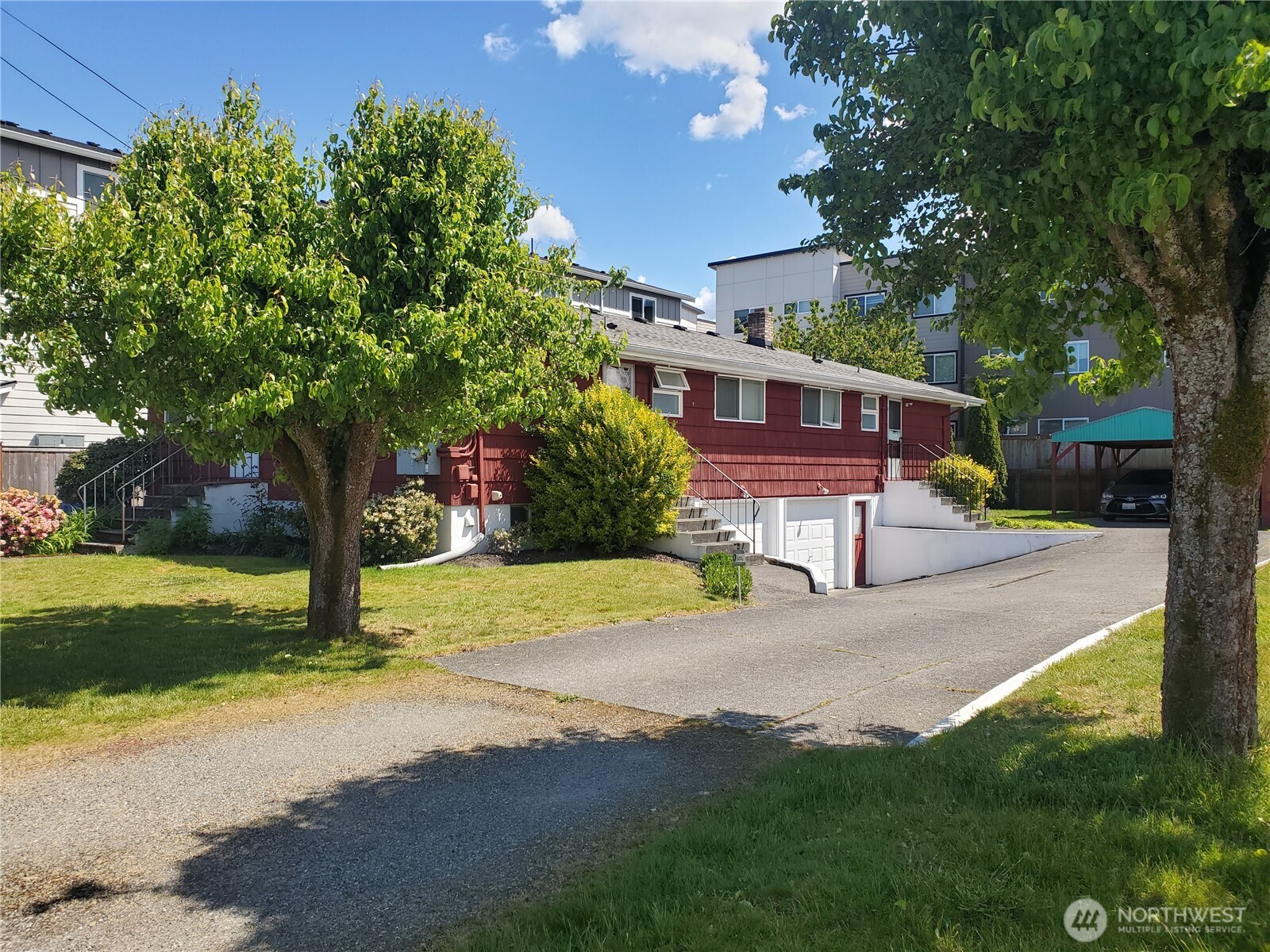 238-240 South 70th Street Tacoma, WA 98408 - Photo 4 of 8 a view of a house with backyard and a tree