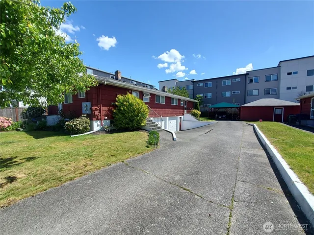 a front view of house with yard and outdoor seating