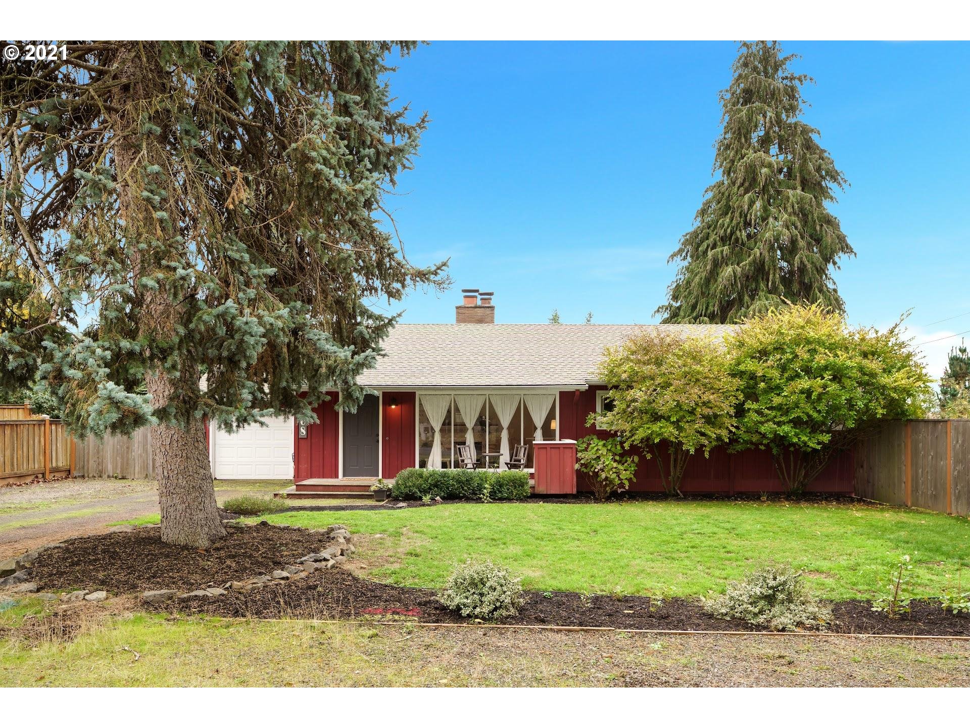 7408 Southwest Mapleleaf Street Portland, OR 97223 - Photo 1 of 32 a front view of a house with a yard