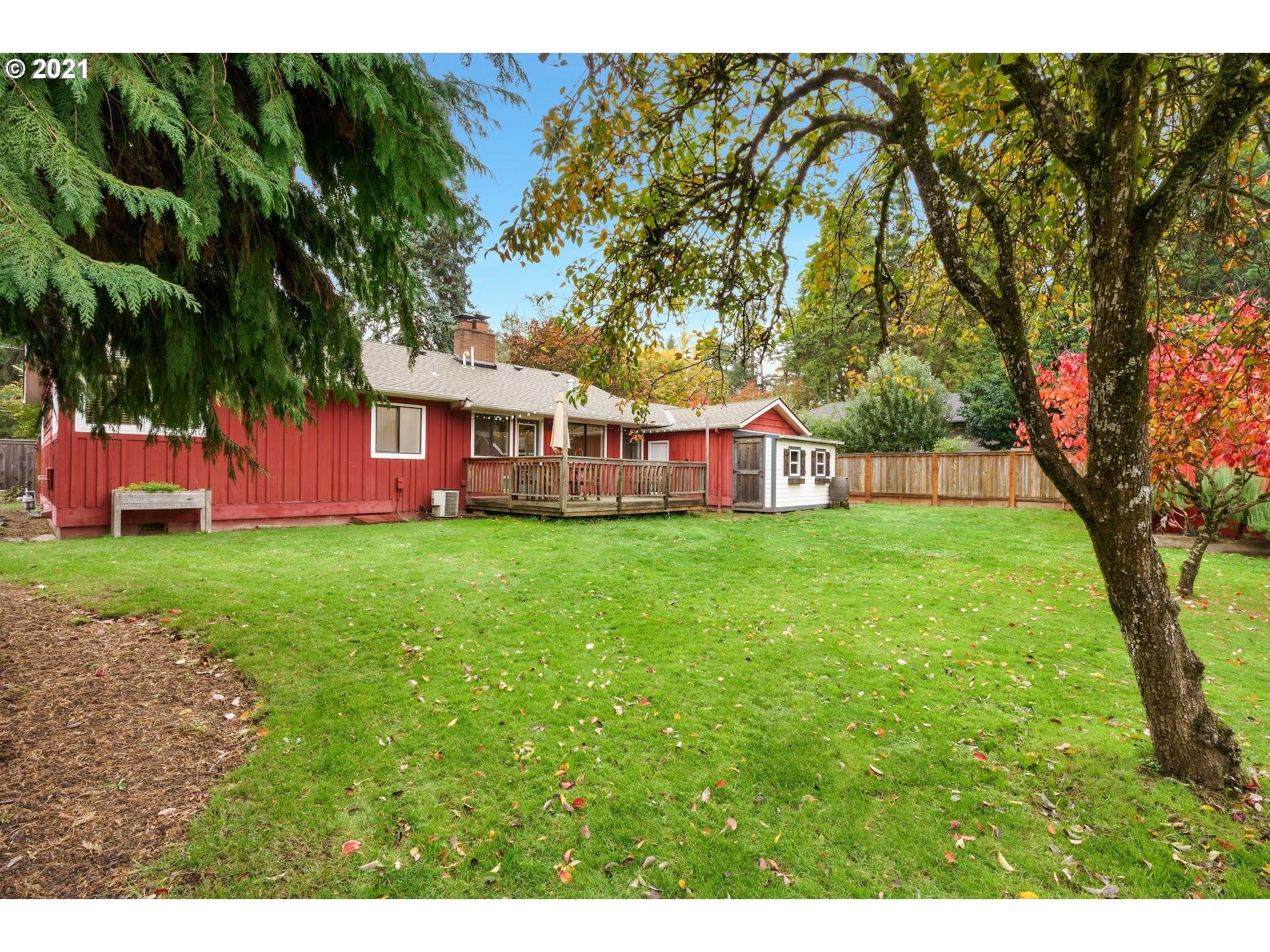 7408 Southwest Mapleleaf Street Portland, OR 97223 - Photo 26 of 32 a view of a house with a big yard