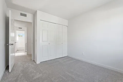 an empty room with a bathroom