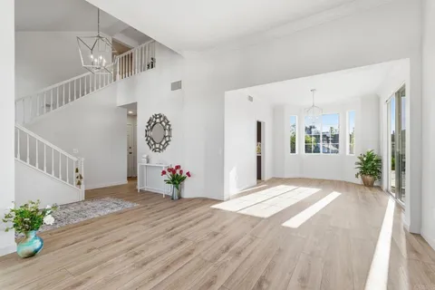 a view of an entryway with wooden floor