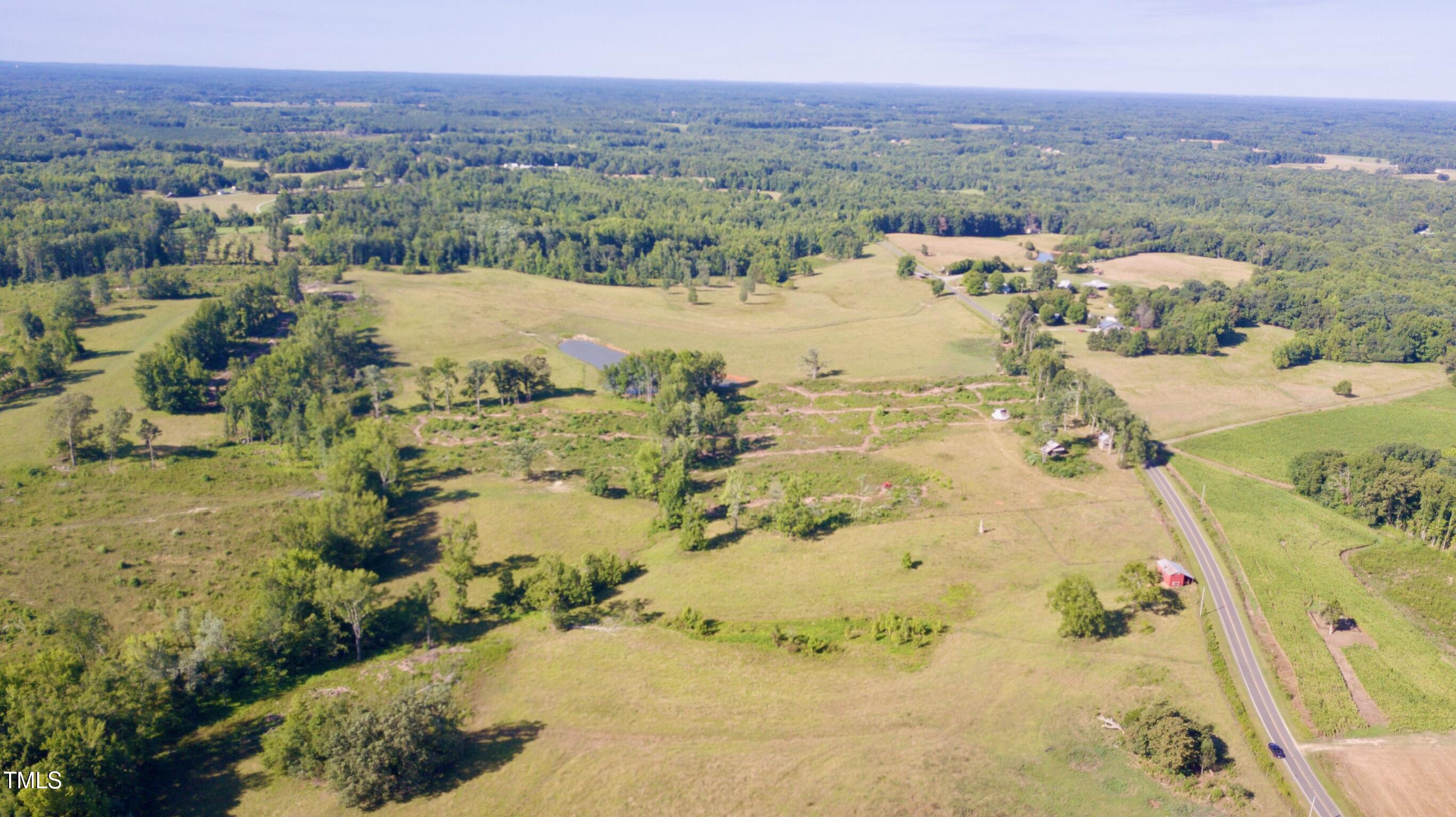 Lot 4 Jones Road Hurdle Mills, NC 27541 - Photo 18 of 20 a view of a lake with mountains in the background