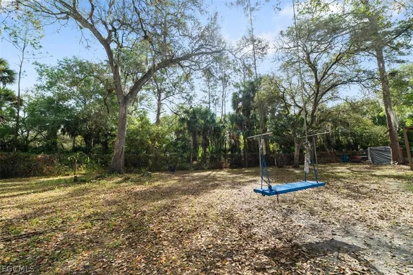 a backyard of a house with lots of green space