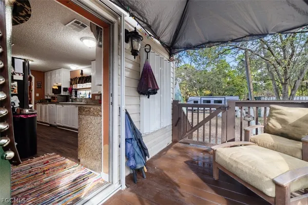 a view of living room kitchen and hardwood floor