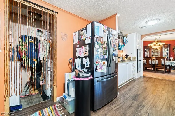 a view of a living room with clothes and toys