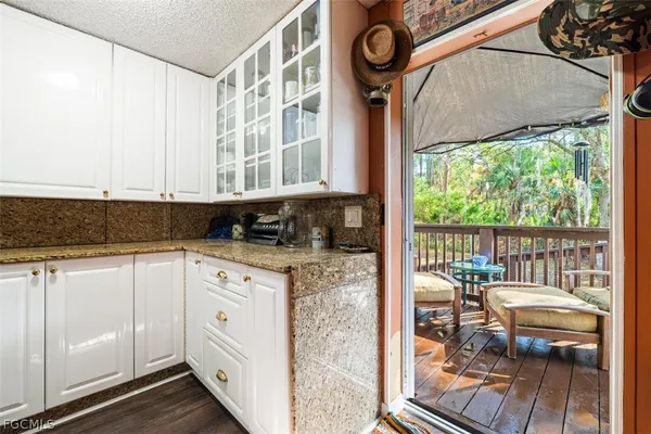 a kitchen with stainless steel appliances granite countertop a stove a sink and cabinets