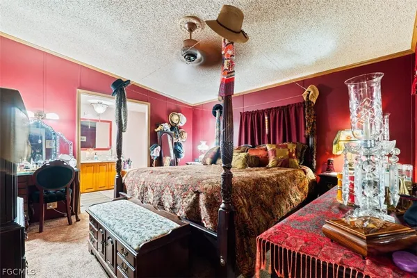 a bedroom with two beds and a chandelier