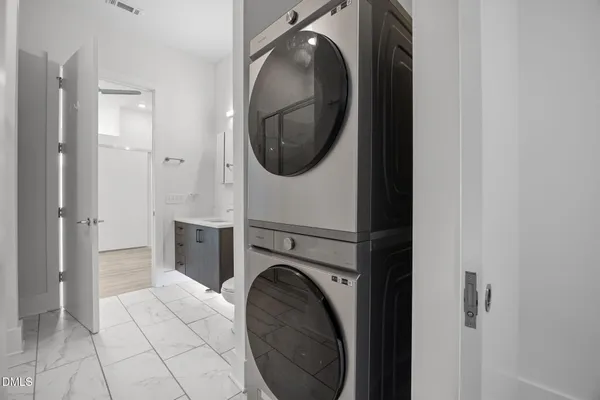 a view of a hallway with washer and dryer