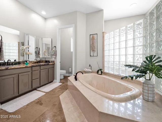 a kitchen with a refrigerator sink stove and cabinets