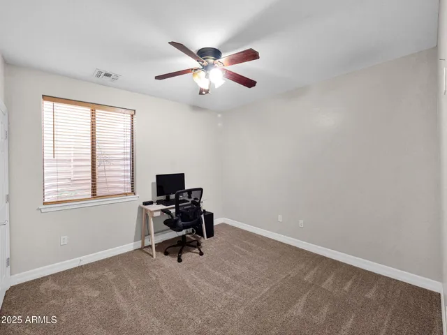 a view of a house with a street