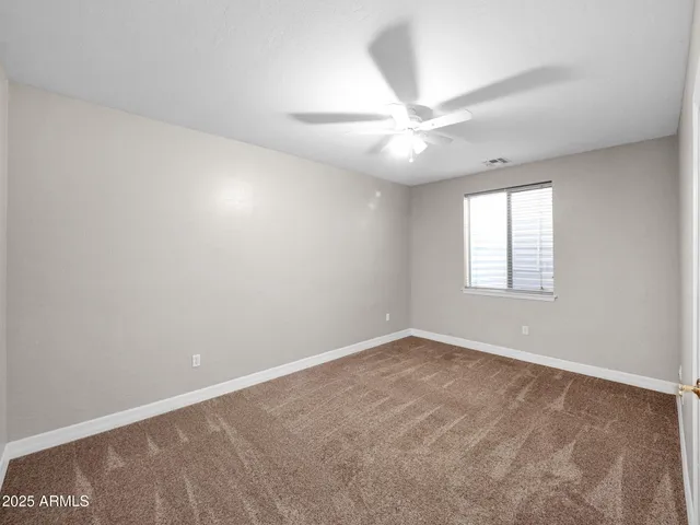 a view of a garden with a house