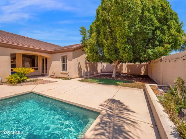 an aerial view of a house with a garden