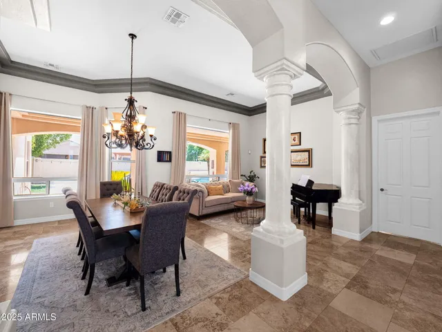 a living room with furniture a rug and a window