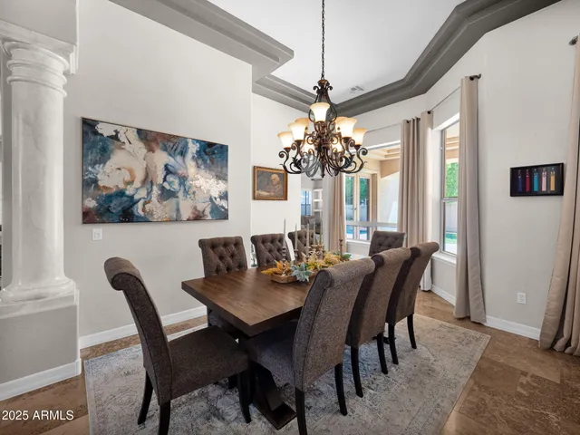 a large kitchen with a table and chairs