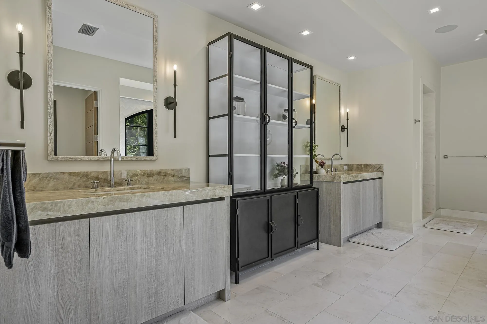 5516 La Crescenta Road Rancho Santa Fe, CA 92067 - Photo 21 of 49 a bathroom with a granite countertop sink a mirror and a shower
