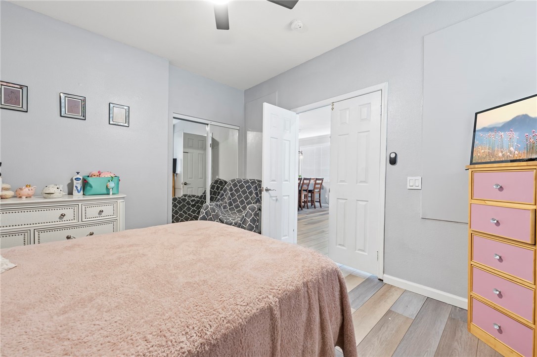 3155 Shipley Place Hemet, CA 92545 - Photo 16 of 26 a bedroom with a bed and a dresser in it
