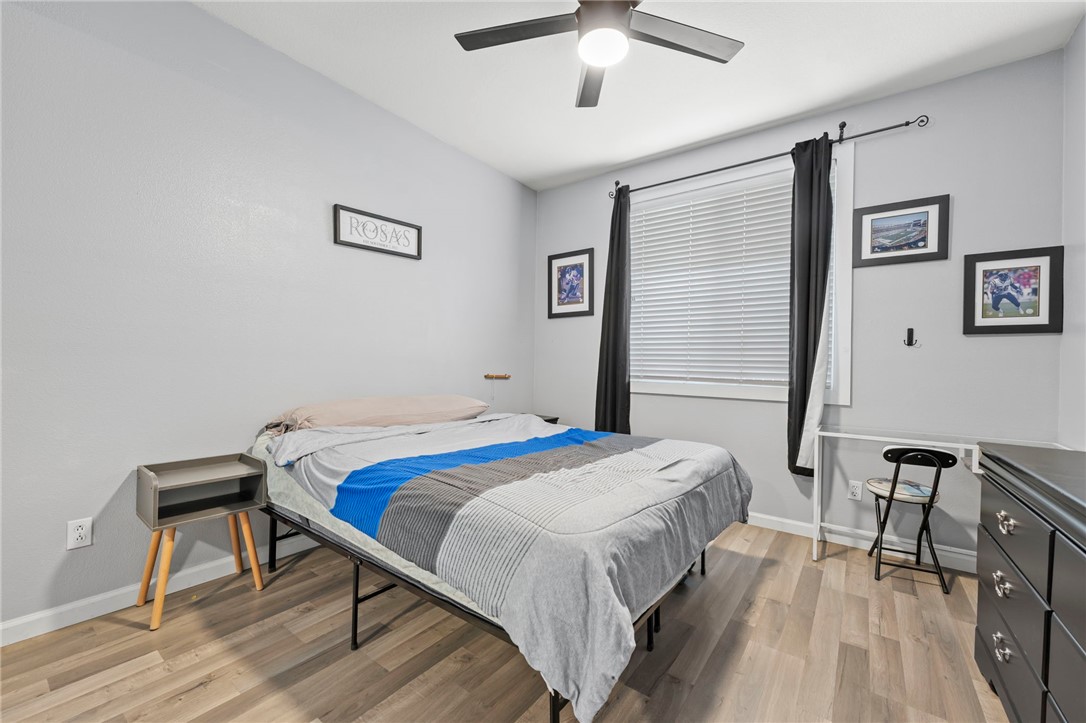 3155 Shipley Place Hemet, CA 92545 - Photo 18 of 26 a bedroom with a bed and a table