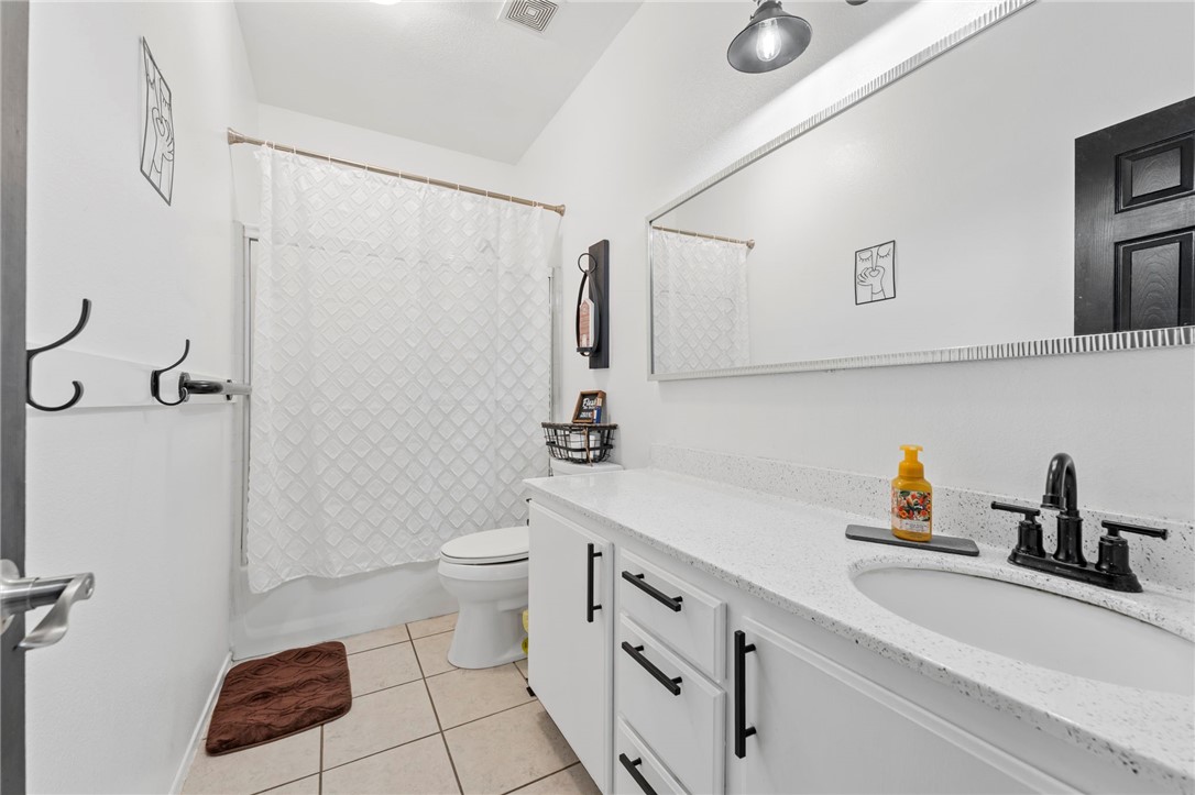 3155 Shipley Place Hemet, CA 92545 - Photo 19 of 26 a bathroom with a sink a toilet and shower