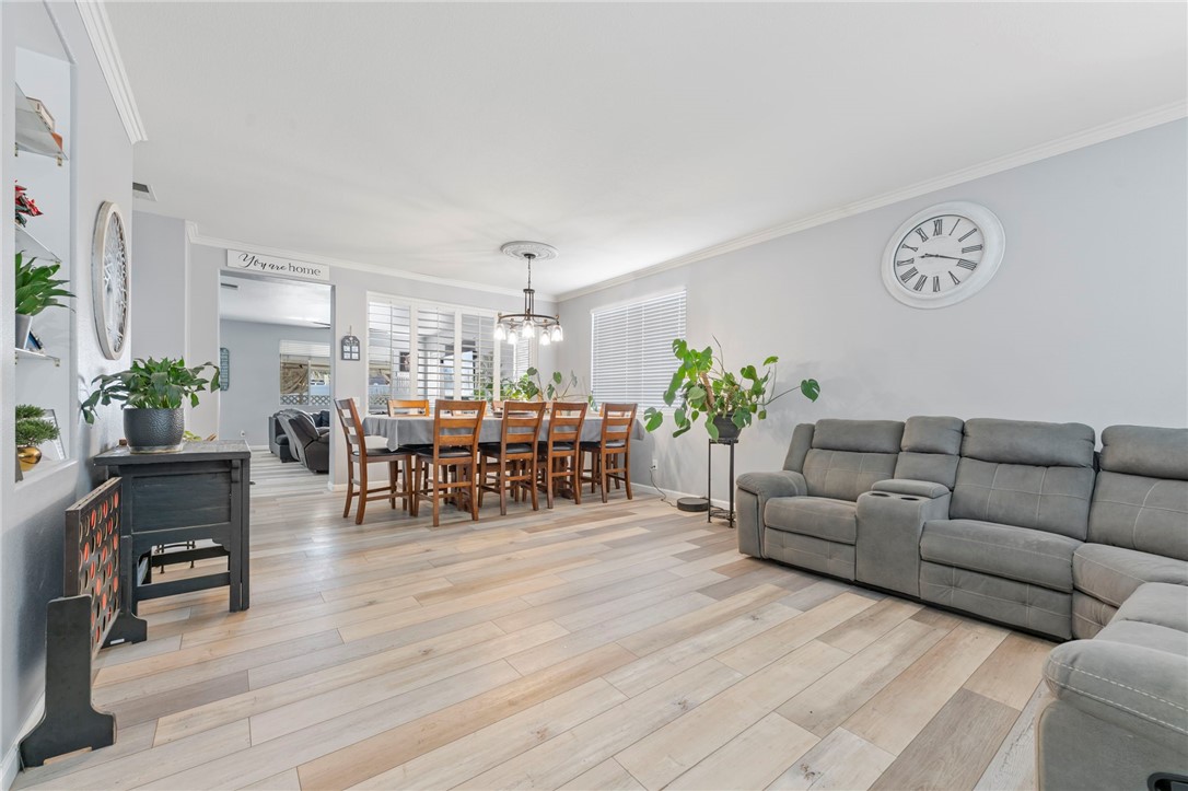 3155 Shipley Place Hemet, CA 92545 - Photo 4 of 26 a living room with furniture and wooden floor