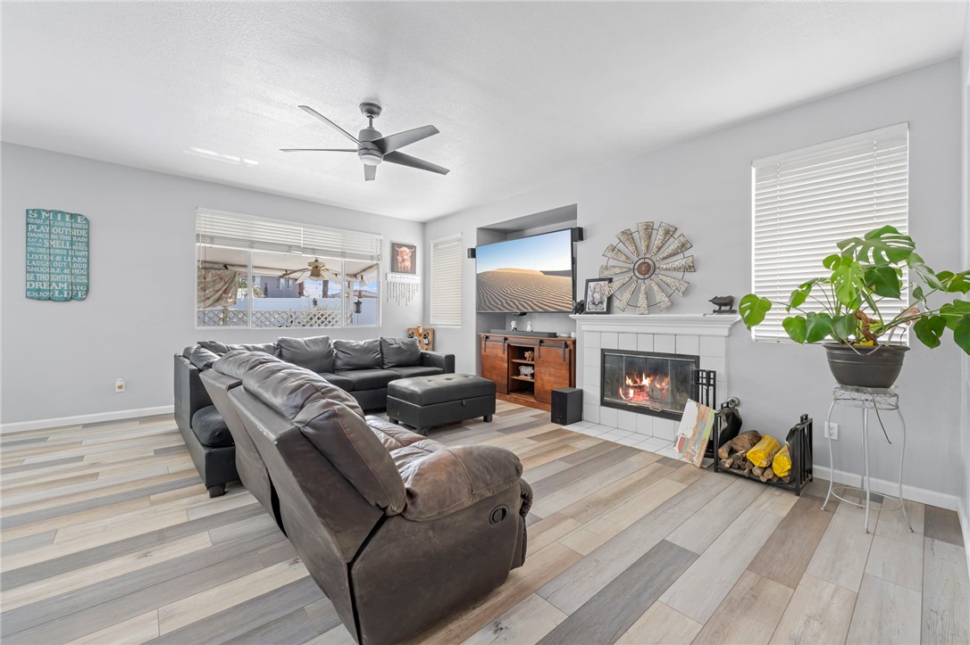 3155 Shipley Place Hemet, CA 92545 - Photo 8 of 26 a living room with furniture and a fireplace