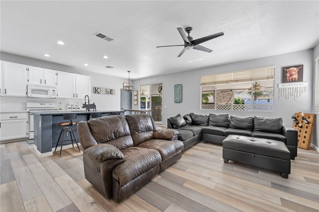 3155 Shipley Place Hemet, CA 92545 - Photo 10 of 26 a living room with furniture and kitchen view