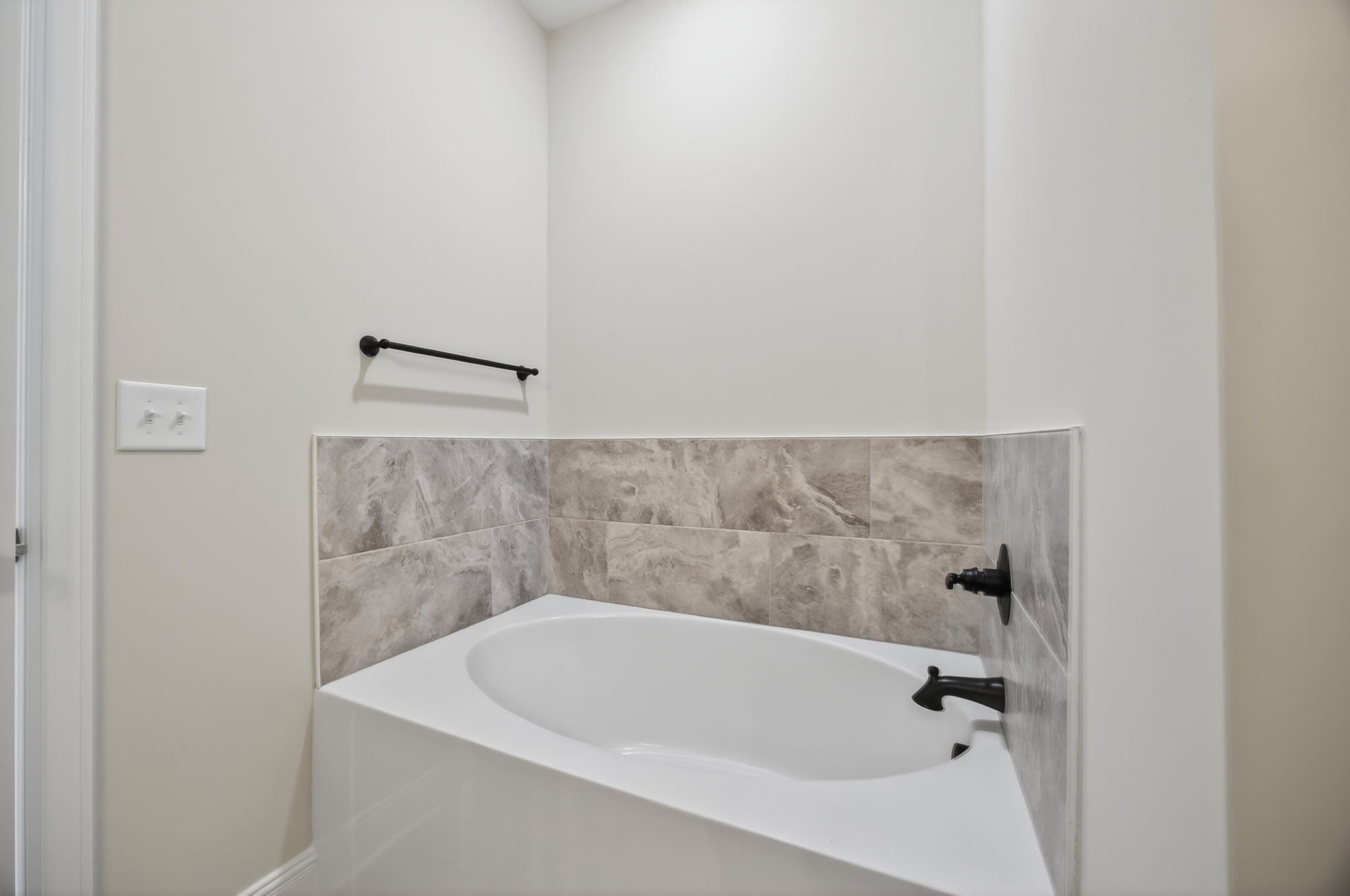 2140 Rylee Way, Unit 45 Greenbrier, TN 37073 - Photo 33 of 42 a bathroom with a white bath tub and a shower